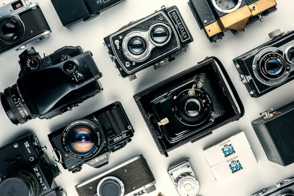 Tools Don't Replace Talent assorted black and gray cameras