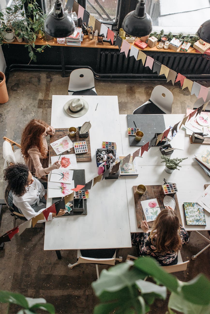 people sitting at table with assorted items